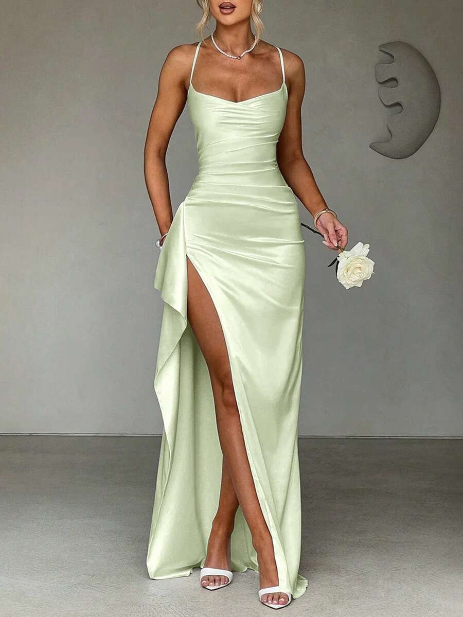 Dark teal satin gown front view styled with gloves and side slit
