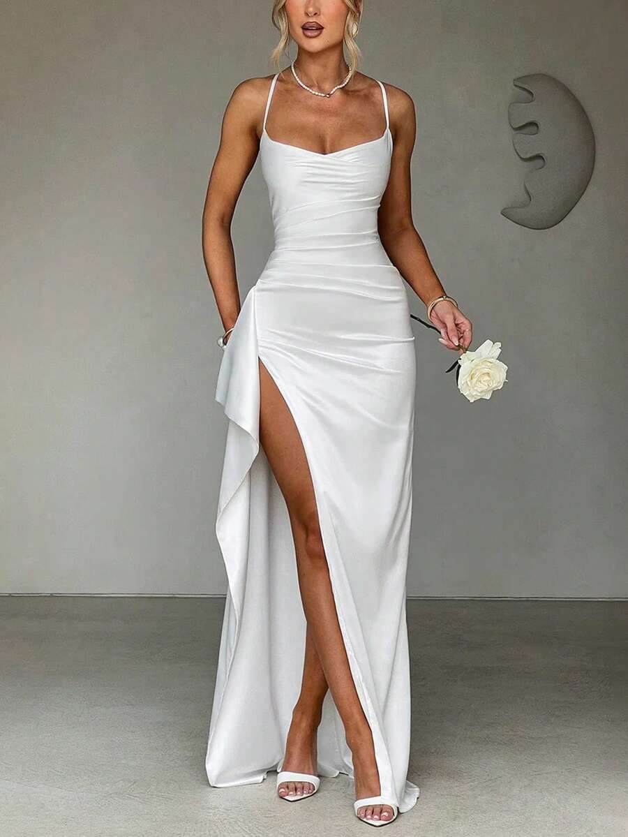 Royal-blue satin gown back view showing crossed straps and full-length skirt