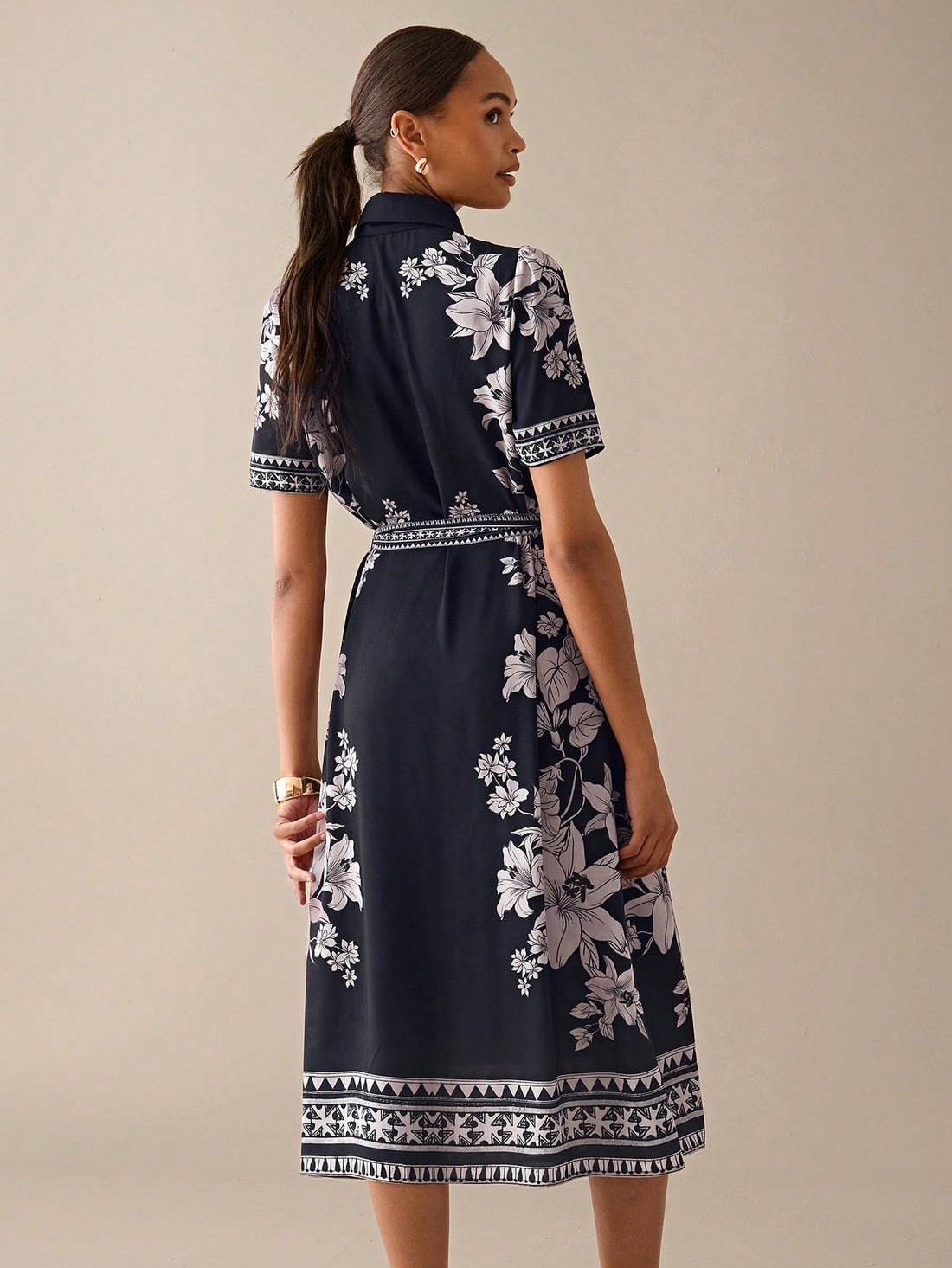 Step into summer with this playful floral print midi dress, designed to brighten your day and your wardrobe. Featuring short sleeves and a flattering waist belt, it effortlessly combines comfort and style for all your sunny outings. Whether you're strolling through a park or enjoying a casual brunch, this dress adds a cheerful touch to every moment.