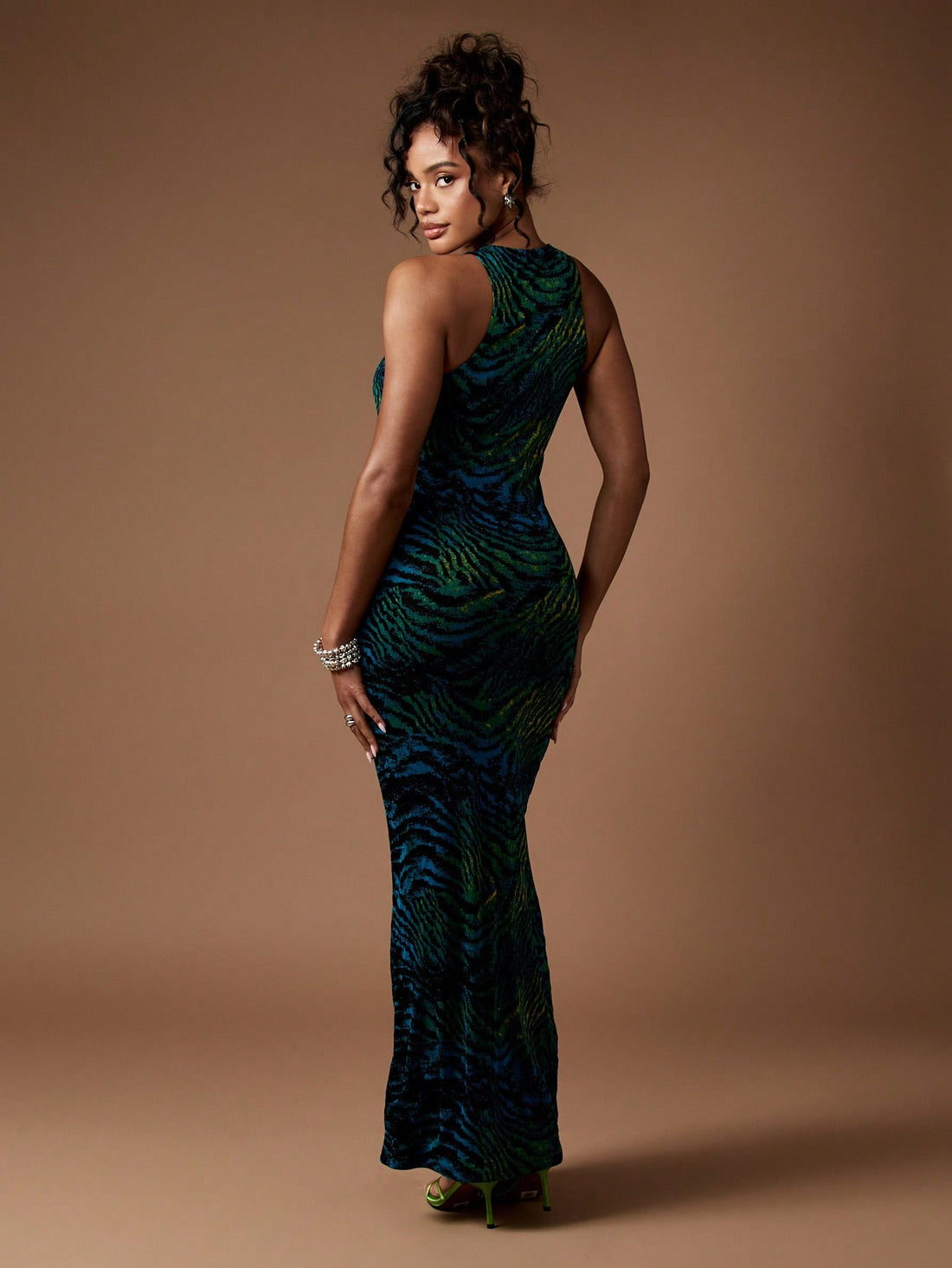Step into the season with flair in this Elegant Animal Print Maxi Dress. Designed for fall and winter, its bold pattern and flowing silhouette make it a showstopper at weddings and formal events. Feel confident and chic as you blend wild style with cozy sophistication—perfect for turning heads and stealing the spotlight wherever you go!