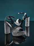 Crystal platform heels close up showing wide toe strap
