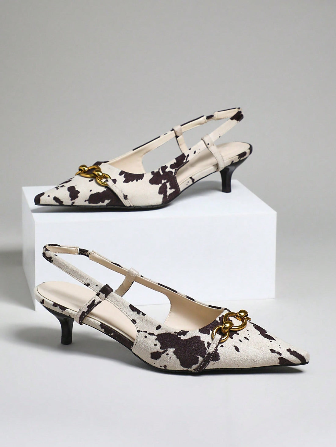 Step out in style with these playful cow print back-strap heels that blend trendy design with ultimate comfort. Their minimalist look adds a chic touch to any outfit, while the secure back strap keeps you dancing all day. Perfect for those who love a fun twist on classic elegance!