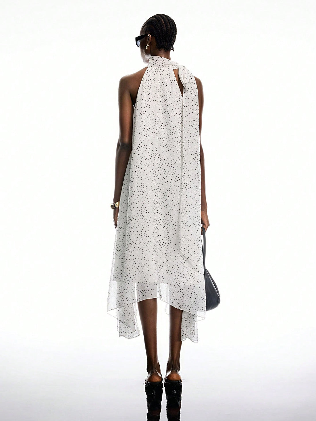 Step out in style with this playful polka dot mid-length dress, designed to bring charm to any occasion. Its flattering cut and breezy fabric make it perfect for casual outings or spontaneous adventures. Embrace effortless elegance and let your fun side shine through every twirl.