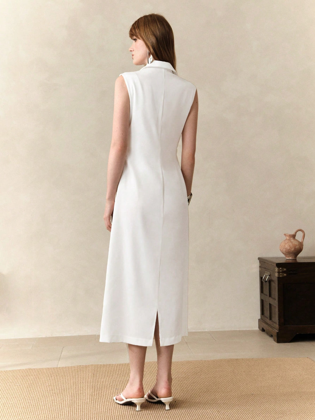 Step into style with this Elegant Women's Deep V-Neck Twist Detail Sleeveless Dress. Perfect for the office or back-to-school days, its flattering twist detail and sleek sleeveless design keep you cool and confident. Dress it up or down for a playful yet polished look that turns heads wherever you go!