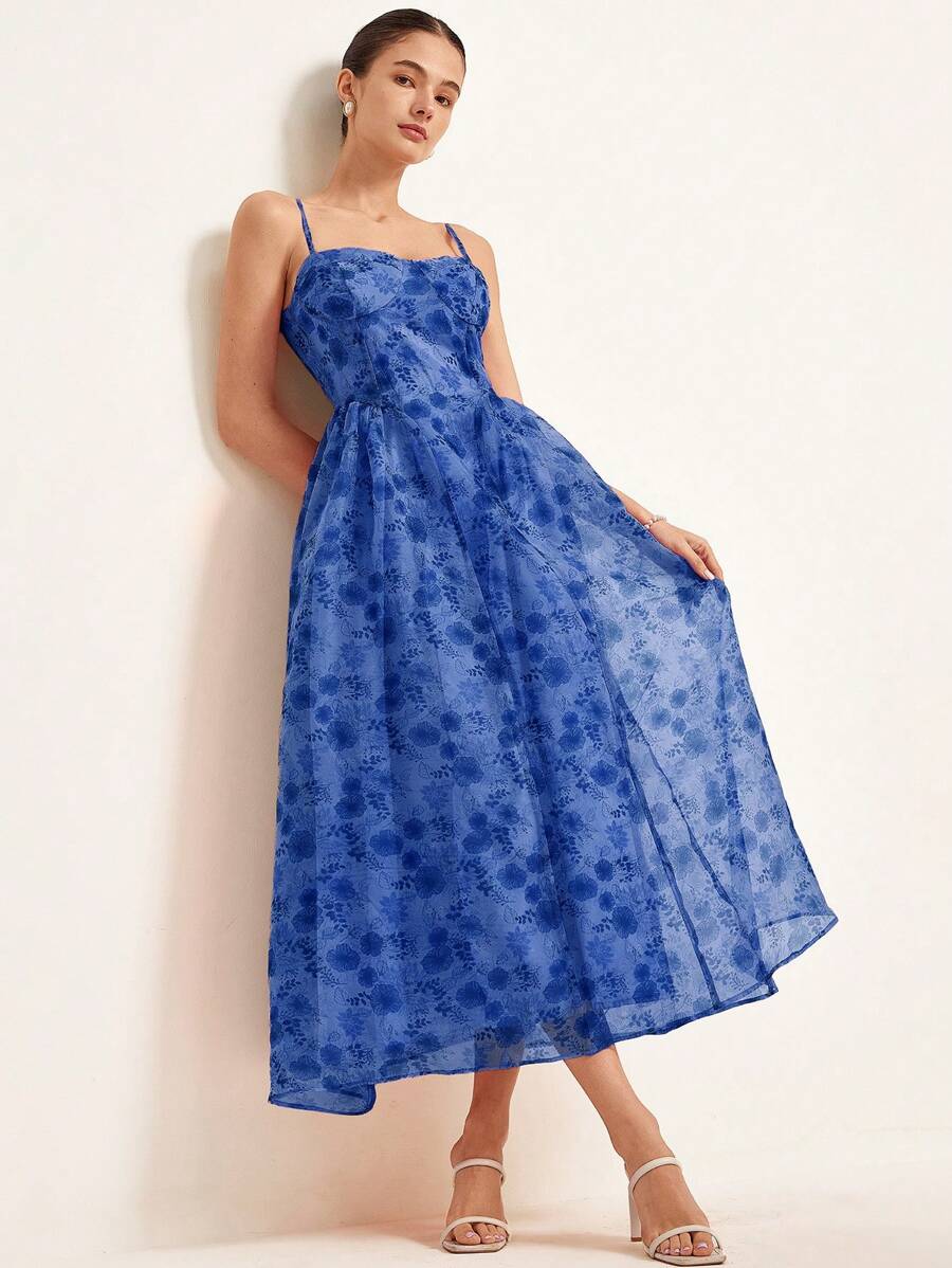 Step into a world of whimsical charm with this Bohemian Organza Slip Dress. Featuring a delicate random floral print, its lightweight organza fabric floats effortlessly, making it perfect for any occasion—from garden parties to casual strolls. The playful design adds a touch of carefree elegance to your wardrobe, ensuring you feel as vibrant as the blooms that inspire it.