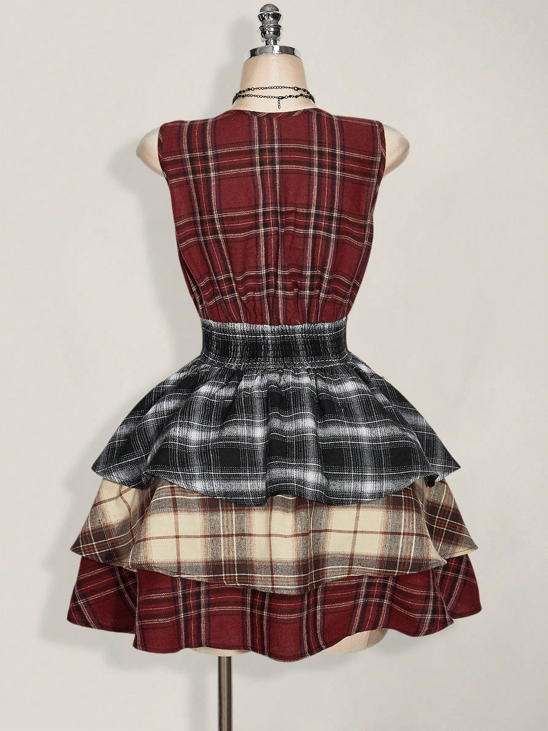 Step into retro charm with this Plus Size V-Neck Contrast Plaid Midi Dress. Featuring a playful mix of vintage Y2K vibes, ruched detailing, and tiered layers, it flatters your curves while keeping comfort front and center. Perfect for making a statement at any gathering, this dress blends classic plaid with a fresh, fun silhouette you'll love to wear again and again.