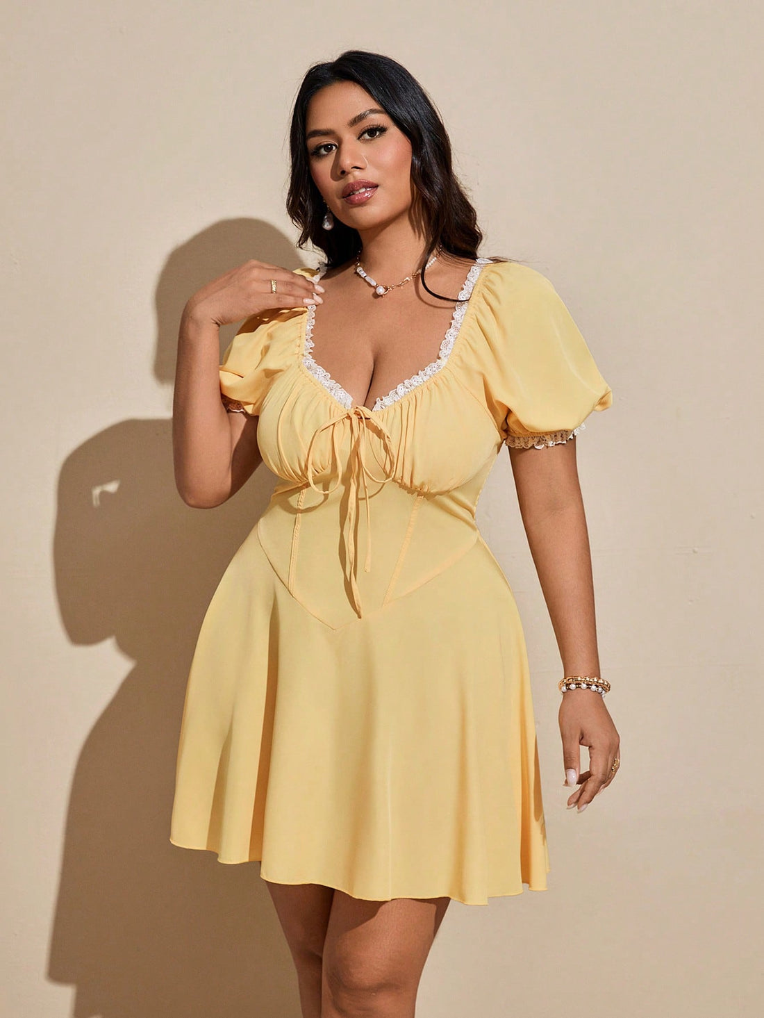 Turn heads on your next getaway with this playful plus size vacation dress. Featuring delicate lace trim and a charming bow detail, it combines comfort with flirty style effortlessly. Perfect for sunny days and breezy evenings, this dress lets you embrace your curves while keeping things light and fun.
