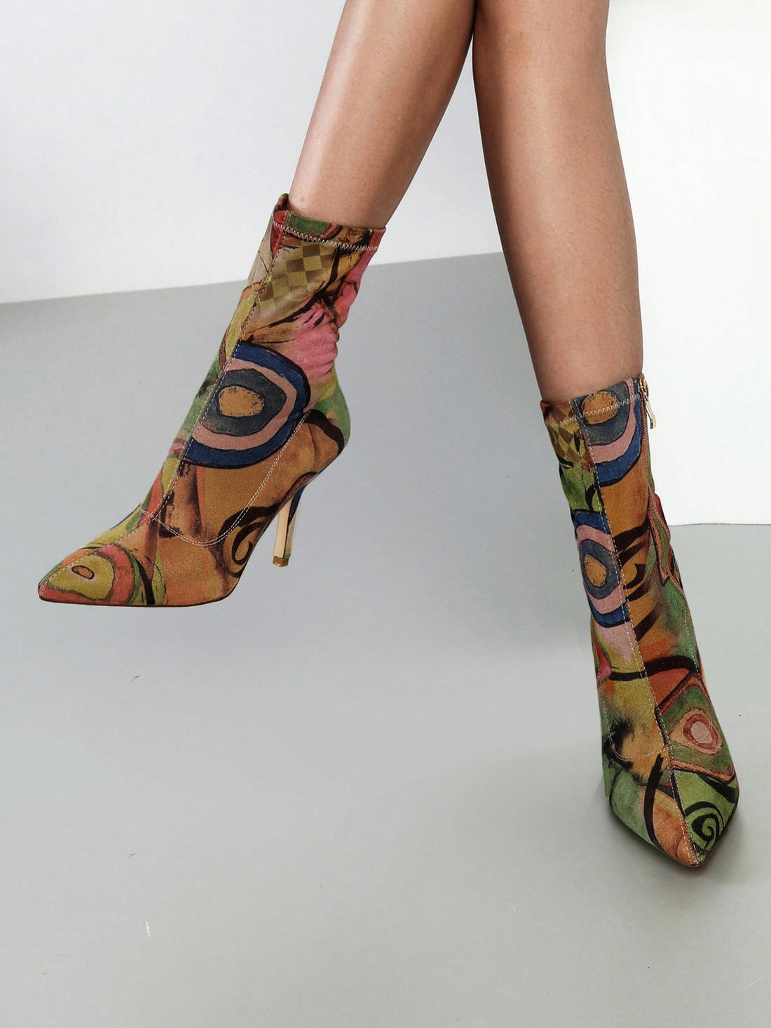 Step out in style with these Stretch Pointed Toe Sock Booties! Featuring a sleek mid-calf design and a sharp stiletto heel, they add a playful edge to any outfit. The unique all-over print makes each pair a standout, perfect for turning heads wherever you go. Comfortable and chic, these ankle boots blend fashion and fun effortlessly.