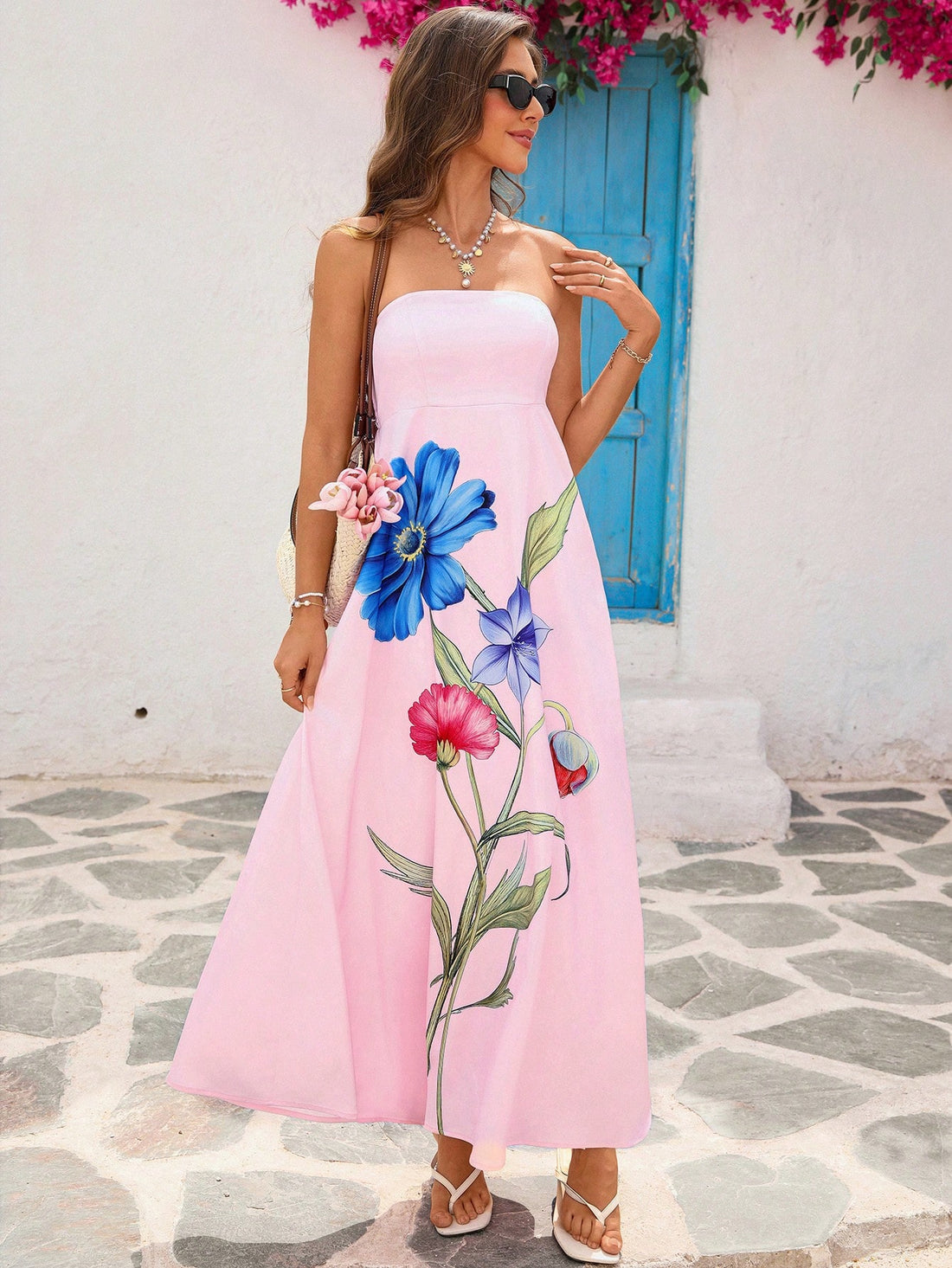 Step into sunshine with this Elegant Floral Print Strapless Maxi Dress, your perfect companion for summer vacations and beach getaways. Its flowing silhouette and vibrant floral design keep you cool and chic, while the strapless cut adds a flirty touch. Whether you're strolling along the shore or sipping cocktails by the pool, this dress brings playful elegance to every sunny moment.