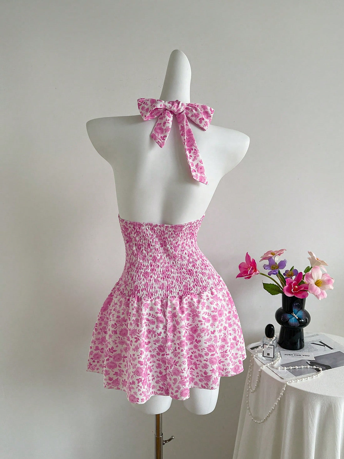 This playful sleeveless dress features a charming ditsy floral print and a flattering shirred bodice, perfect for short getaways. Its lightweight fabric keeps you cool and comfortable while adding a touch of effortless style to your travel wardrobe. Easy to pack and even easier to wear, it’s your go-to piece for sunny adventures and spontaneous fun.