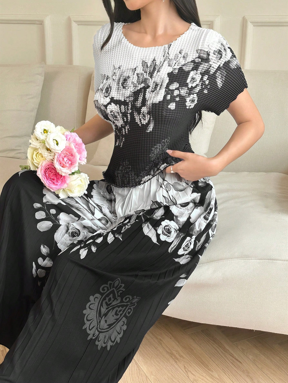 Elevate your everyday style with this gorgeous two-piece set that's all about comfort meeting fashion! The embossed flower print top features a relaxed, loose fit that flatters every body type, while the matching wide-leg pants create those coveted flowing lines. Perfect for casual outings, weekend brunches, or just lounging in style—this set proves you don't have to sacrifice comfort for looking absolutely fabulous. Mix, match, or wear together for instant effortless chic that'll have everyone asking where