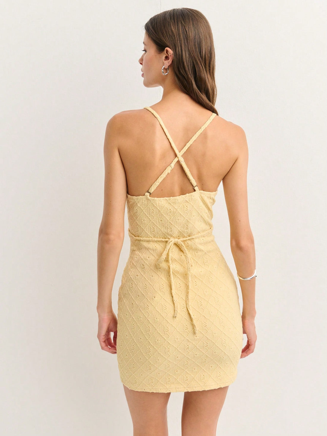 Turn heads this season in our Halter Bodycon Mini Dress—the ultimate summer essential that celebrates your curves with confidence. Crafted from textured knit fabric, this playful piece features a flattering V-neck and halter neckline that keeps you cool and chic. The fitted silhouette hugs you in all the right places, making it perfect for nights out, beach parties, or any occasion where you want to feel fabulous. Pair it with your favorite heels and minimal accessories for an effortlessly stunning look tha