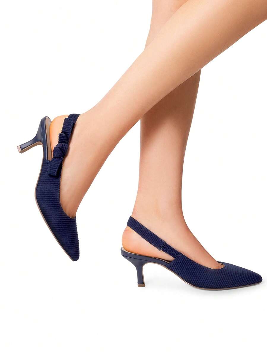 Step into sophistication with these charming slingback kitten heels, where delicate bow details meet timeless elegance. Perfect for weddings, galas, and those moments when you want to feel fabulous without sacrificing comfort, these pumps strike the ideal balance between style and wearability. The graceful kitten heel provides just enough lift to elongate your silhouette while keeping your feet happy all evening long. Whether you're dancing at a reception or mingling at a cocktail party, these beauties deli
