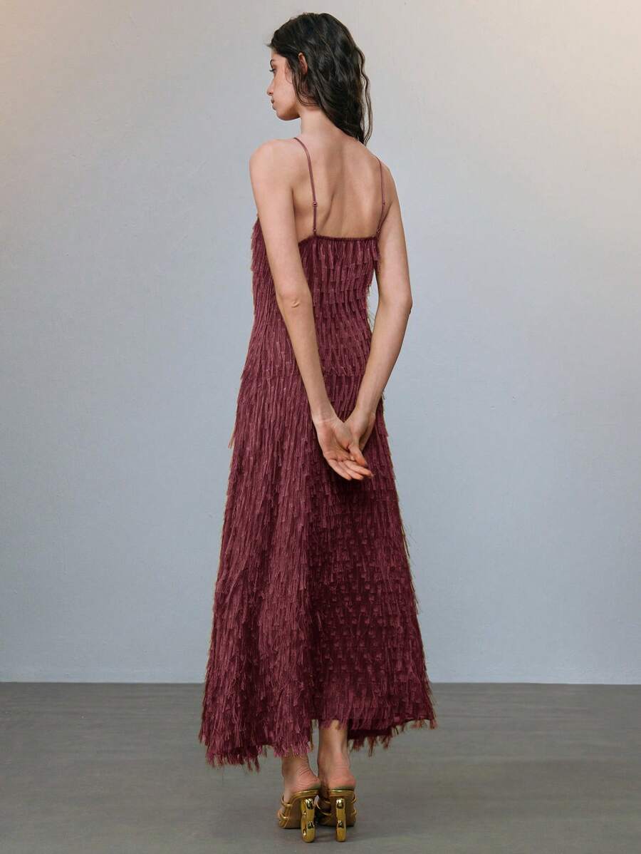 Step into summer with this Chic Fringe Flowy Dress, designed to turn heads at weddings, parties, or your next vacation getaway. Featuring delicate spaghetti straps and a breezy silhouette, it dances with every step, adding a playful touch to your elegant look. Perfect for warm days and lively nights, this dress blends comfort and style effortlessly. Get ready to twirl and shine wherever you go!