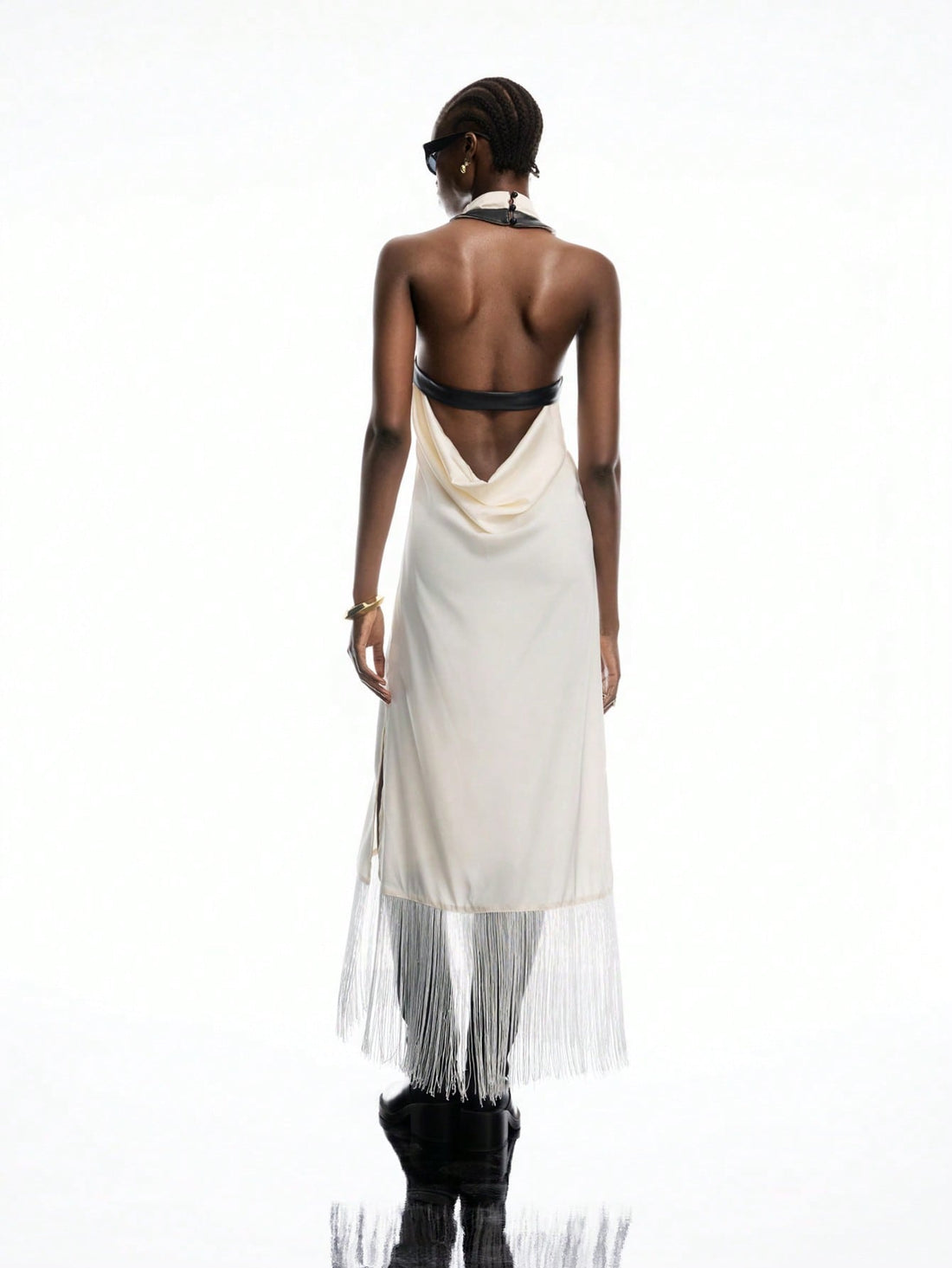 Step into summer with this Elegant White Satin Buckle-Back Fringe Maxi Dress, perfect for your boho-chic adventures. The silky satin fabric flows effortlessly, while the playful fringe and adjustable buckle-back add a flirty touch. Whether you're strolling the beach or dancing under the stars, this dress brings carefree style and comfort to your vacation wardrobe.
