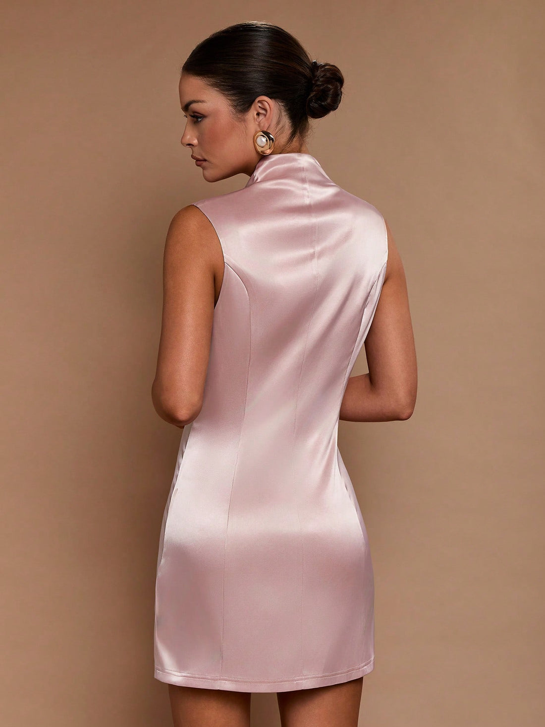 Elevate your warm-weather wardrobe with this chic mini dress that effortlessly transitions from brunch to evening plans. The striking metal buckle detail adds a touch of sophistication and edge, while the sleek silhouette flatters every figure. Perfect for spring and summer adventures, this versatile piece pairs beautifully with sneakers for casual vibes or heels for a night out. Whether you're exploring the city or catching sunset with friends, this dress delivers style that turns heads and confidence that