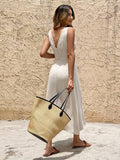 Rear resort view of ivory A-line midi dress with deep V back and lace-trim straps