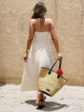 Back view of cream floor-length maxi dress with slim fitted silhouette