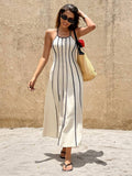 Ivory maxi dress styled with woven tote and black sandals outdoors