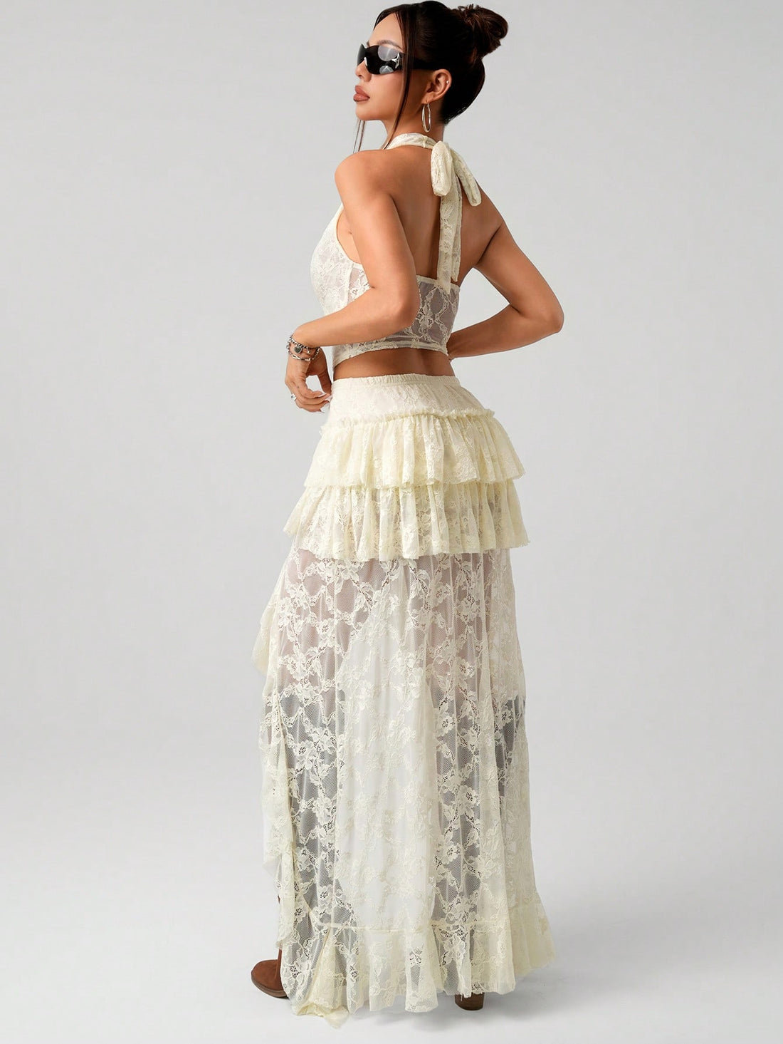 Turn heads this season with our stunning 2-piece set featuring a delicate lace halter camisole paired with a chic asymmetrical mini skirt. Perfect for summer celebrations or back-to-school vibes, this playful ensemble combines feminine elegance with modern edge. The soft lace detailing adds sophistication while the asymmetrical cut keeps things fun and flirty. Whether you're hitting a 4th of July party or making a statement on campus, this versatile set delivers style that's equal parts bold and beautiful.