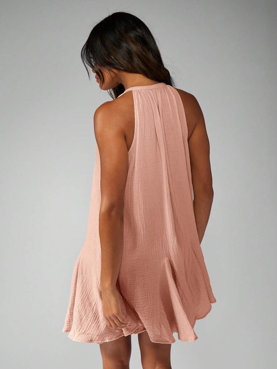 Step into sunshine with this playful Bohemian Tie-Front Mini Dress. Featuring a breezy halter neck and sleeveless design, it’s lightweight for those carefree summer days and easy resort vibes. Perfect for twirling at the beach or dancing under the stars, this dress blends comfort and style effortlessly.