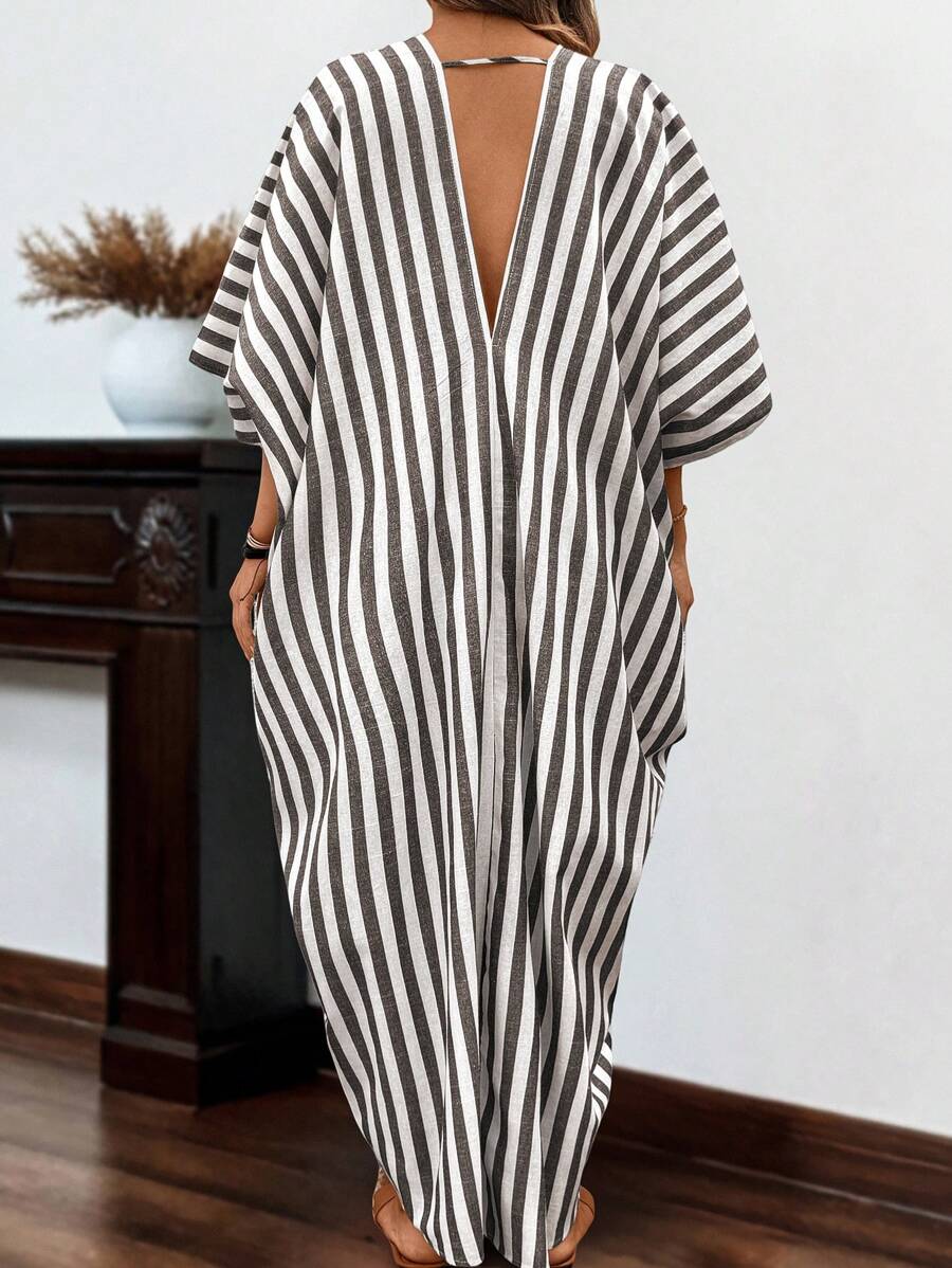 Embrace effortless coastal vibes in this breezy linen beach dress that's as comfortable as it is chic. Featuring relaxed striped detailing and long sleeves for sun protection, this plus-size beauty transitions seamlessly from beach days to seaside dinners. The flowing silhouette flatters every curve while the breathable linen keeps you cool when temperatures rise. Whether you're lounging by the water or strolling through a beachside market, this bohemian essential delivers that carefree, sun-kissed style yo