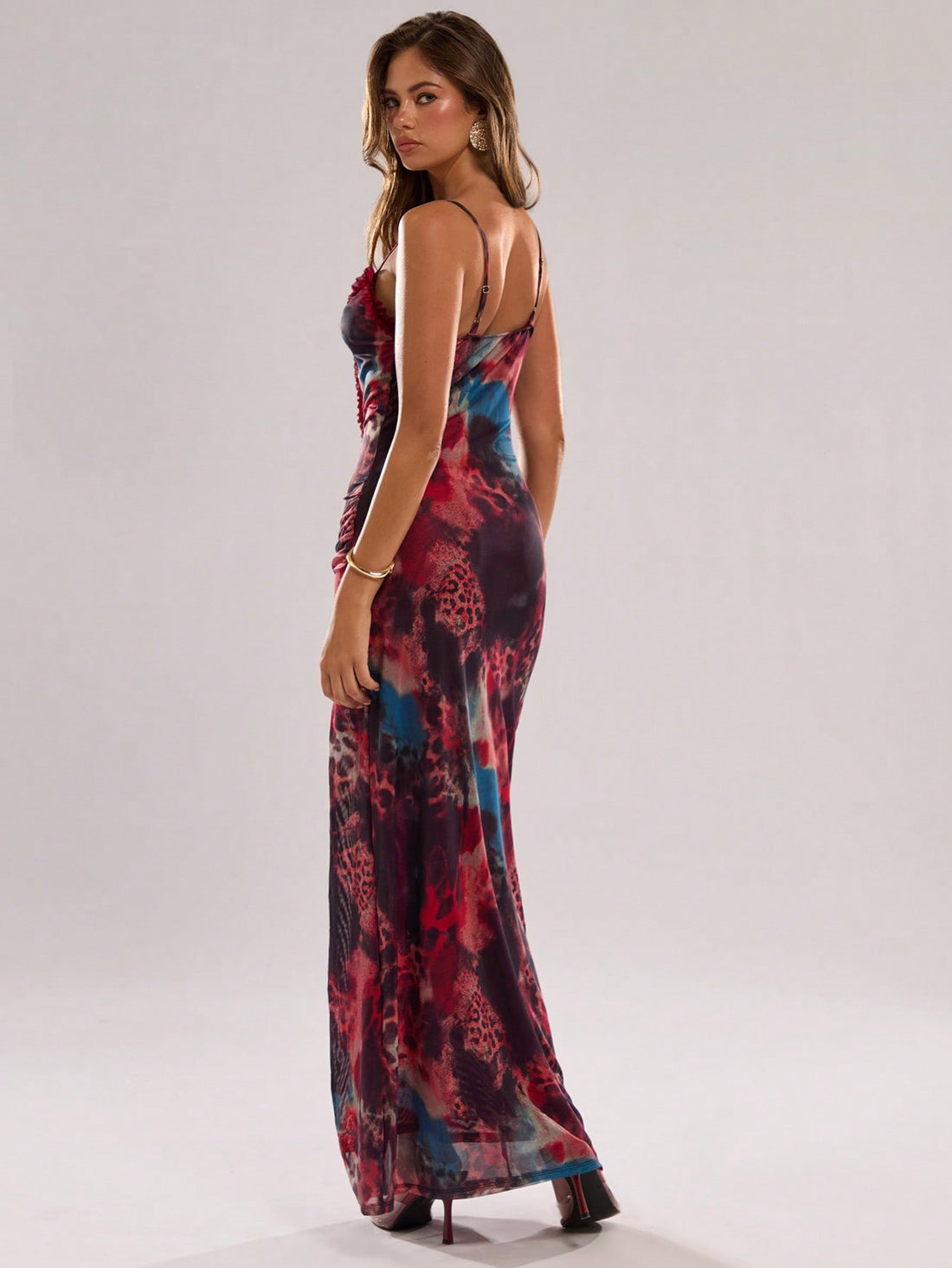 Turn heads in this playful gradient animal print maxi slip dress! Featuring flirty ruffles and a daring high slit, this versatile showstopper transitions effortlessly from beach days to night parties. The eye-catching design hugs your curves in all the right places while the flowing silhouette ensures you'll dance the night away in comfort and style.