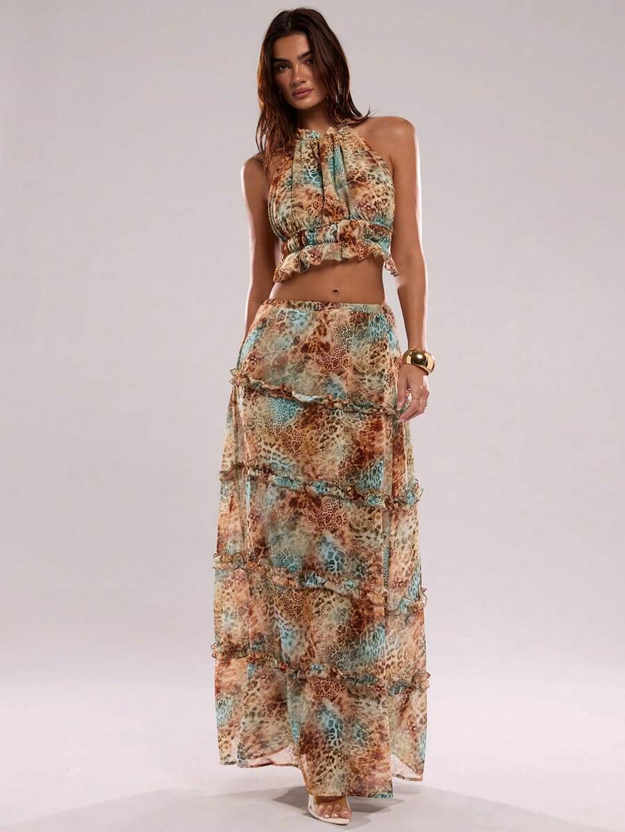 Make a bold statement this season with our Leopard Print Halter Neck Ruffled Backless Suit. Featuring a striking leopard pattern and flattering halter neckline, this piece combines edge with elegance. The delicate ruffled detailing adds movement and dimension, while the backless design offers a daring, sophisticated look. Perfect for beach getaways, poolside moments, or turning heads at evening parties.