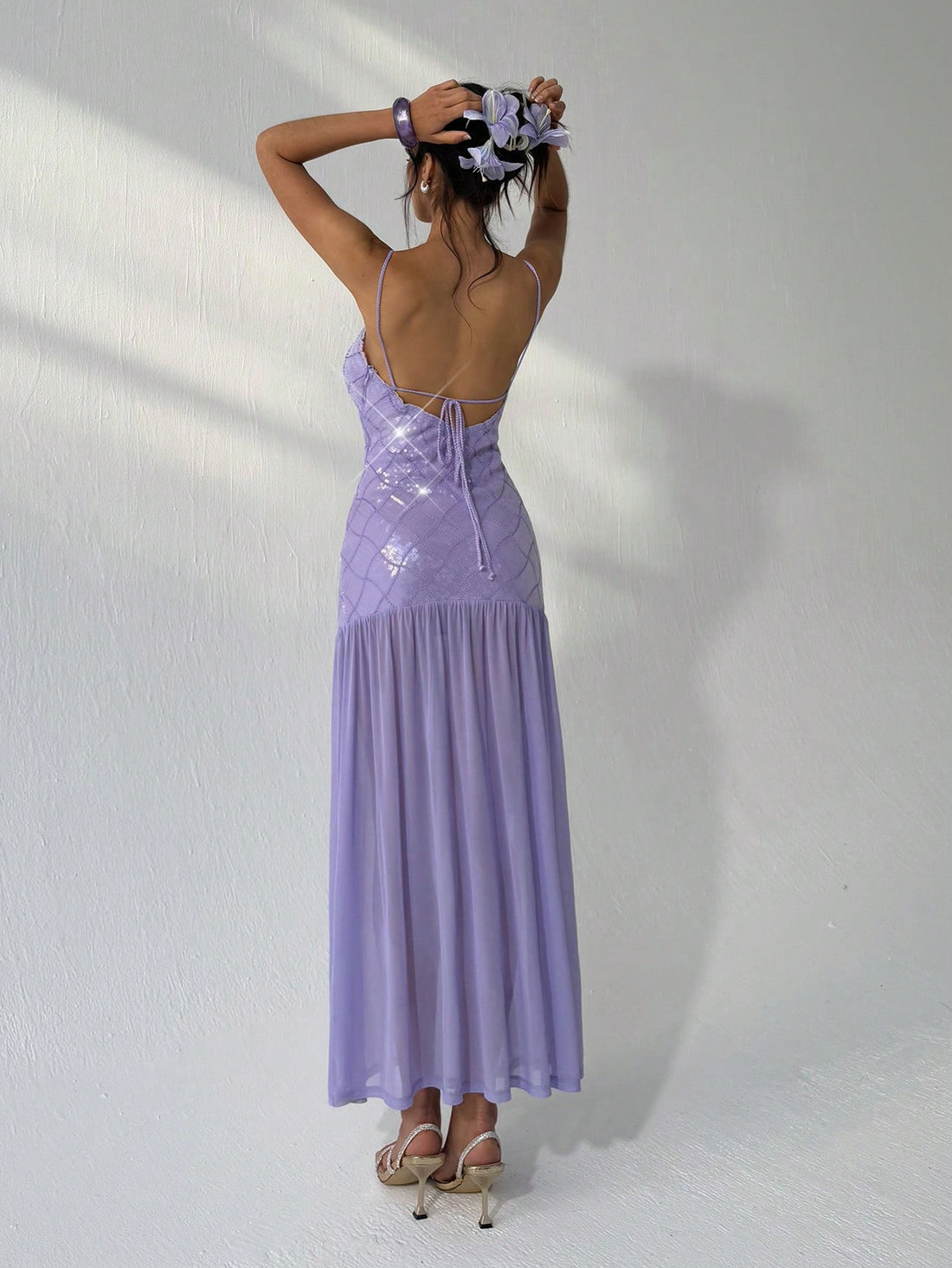 Dazzle with charm in this Light Purple Sequin Slip Dress, where retro fairy vibes meet summer elegance. Its shimmering sequins catch the light with every step, perfect for twirling under the sun or sparkling at evening parties. Lightweight and flowy, this playful gown keeps you cool while adding a magical touch to your wardrobe. Embrace your inner fairy and let your style shine bright all season long!