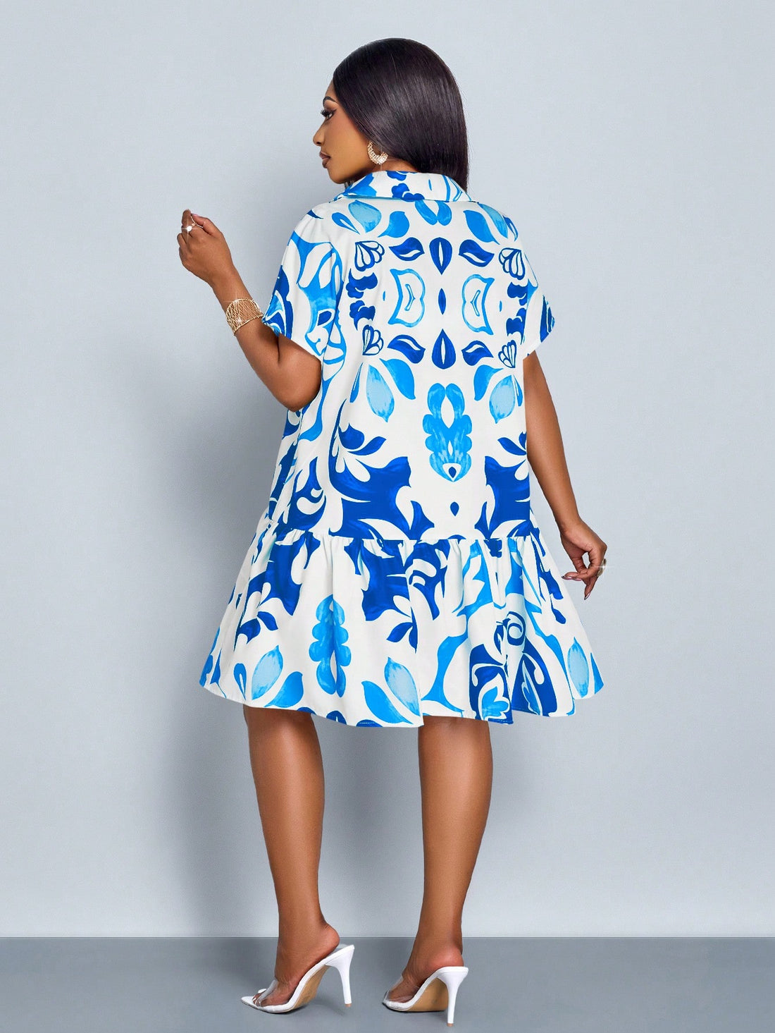 Embrace sunny days in this playful plus size summer dress designed to flatter your curves with a waist-cinching fit. The button-front detail adds a touch of charm, making it easy to slip on for effortless casual style. Perfect for everything from brunch dates to beach strolls, this dress combines comfort and fun in one breezy package.