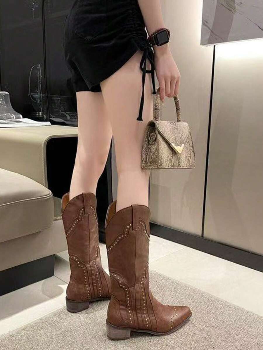 Step into sass with these stylish women's western mid-calf boots! Featuring a trendy V-cut and eye-catching rivet details, they add a bold touch to any outfit. The chunky heel gives you just the right lift for dancing through the day or night with confidence and comfort. Perfect for adding a playful western flair to your wardrobe!