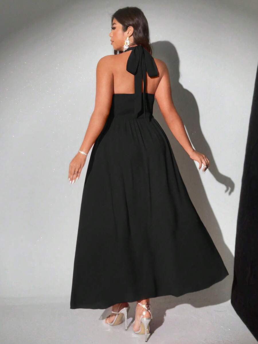 Step into the spotlight with this playful plus size halter dress, featuring a charming bowknot and flirty ruffle hem. Perfect for vacations or parties, it combines comfort and style effortlessly, letting you dance, twirl, and shine all day long. Embrace your curves with a dress that’s as fun as you are!
