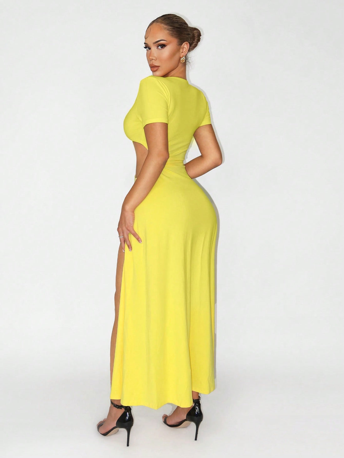 Turn heads at your next celebration in this stunning yellow bodycon dress. The daring plunging neckline and thigh-high slit create an irresistibly bold silhouette that demands attention. Crafted for those who love to make a statement, this dress hugs your curves in all the right ways while keeping things fun and flirty. Perfect for festivals, parties, and nights out where you want to feel confident and fabulous. Slip it on and let your inner glamour shine.