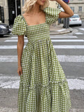 Front close view green white gingham smocked puff sleeve dress with ruffle hem tier