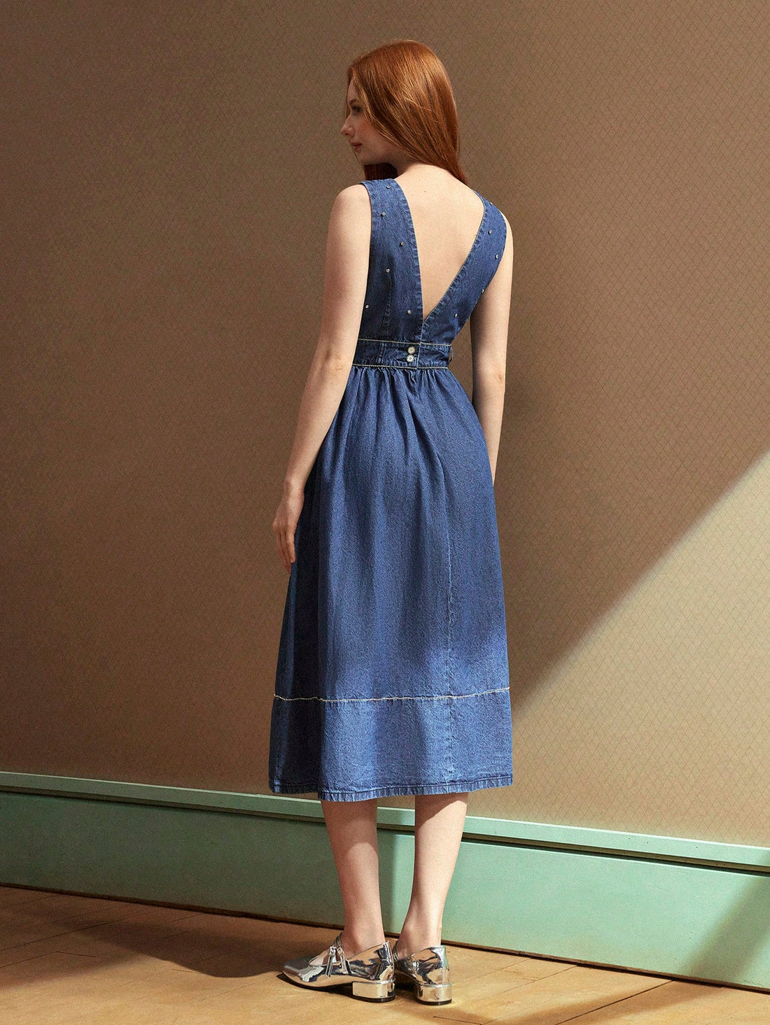 Effortlessly cool meets undeniably comfy in this breezy denim dress! The delicate spaghetti straps keep things light and airy, while the classic denim fabric brings that timeless, go-anywhere vibe. Perfect for casual coffee dates, weekend adventures, or those days when you want to look put-together without trying too hard. Throw on your favorite sneakers for laid-back charm or dress it up with sandals and accessories for instant polish. This wardrobe essential transitions seamlessly from season to season, p