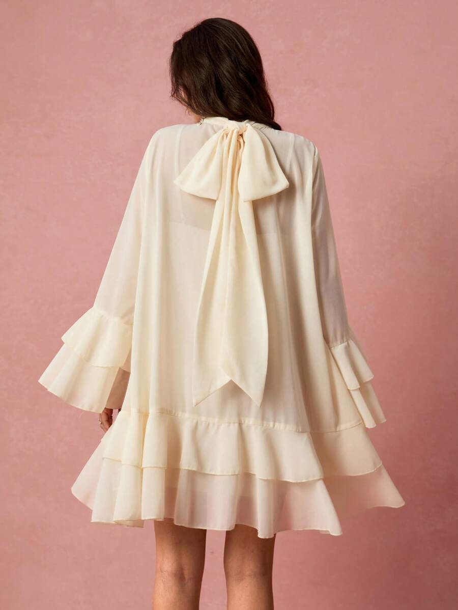 Step out in style with this Elegant Romantic Flare Sleeve Dress, designed for the fashion-forward woman who loves a playful twist. Featuring charming flared sleeves and a flirtatious ruffle hem, this short dress adds movement and fun to every step. Perfect for day or night, it’s your go-to for turning heads and feeling fabulous with effortless romance.