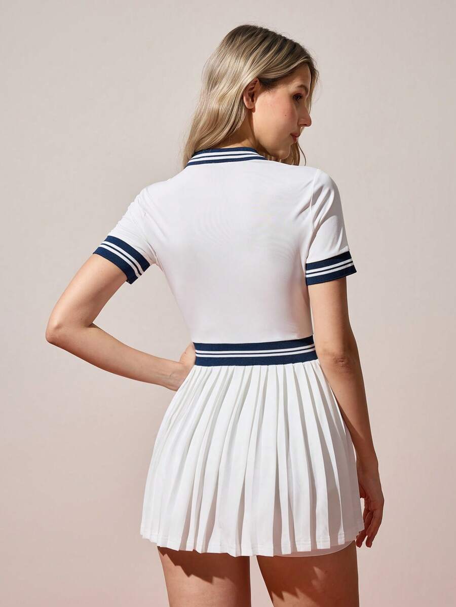 navy and white stripe polo tennis mini dress with pleated skirt built in shorts and pockets image 6