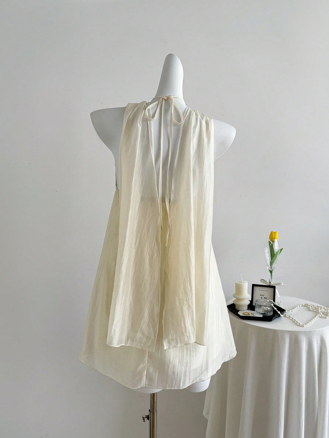 Turn heads with the Parisian Petal Slip Dress, featuring a flirty halter neck and open shoulders that highlight your natural charm. Delicate floral embellishments add a romantic touch, making it perfect for date nights or special occasions. This dress combines sexy elegance with playful style for a look that’s effortlessly captivating.