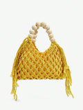 Yellow crochet beach bag front view with net weave side tassels and cream bead handle