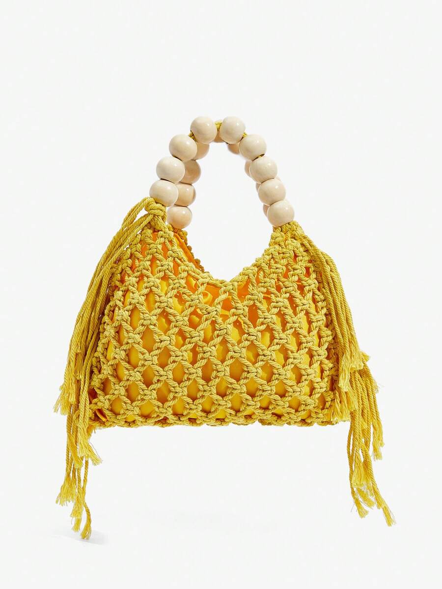 Yellow crochet beach bag front view with net weave side tassels and cream bead handle
