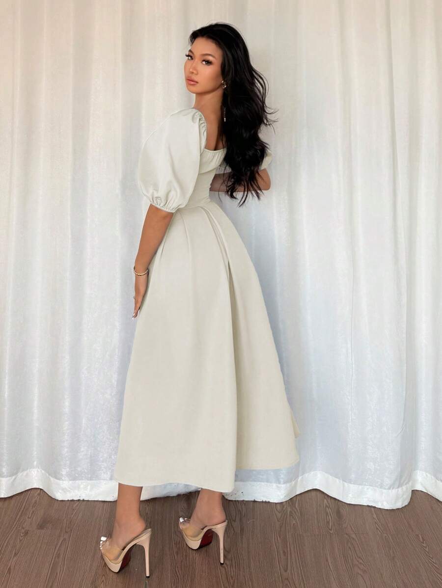 Step into charm with this Elegant Minimalist Puff Sleeve Dress, perfect for your office hours or casual adventures. Featuring a stylish pleated hem and a flattering square neck, it blends comfort and flair effortlessly. The puff sleeves add a fun twist, making every move feel light and playful. Whether you're at a meeting or out with friends, this dress keeps your look fresh and effortlessly chic.
