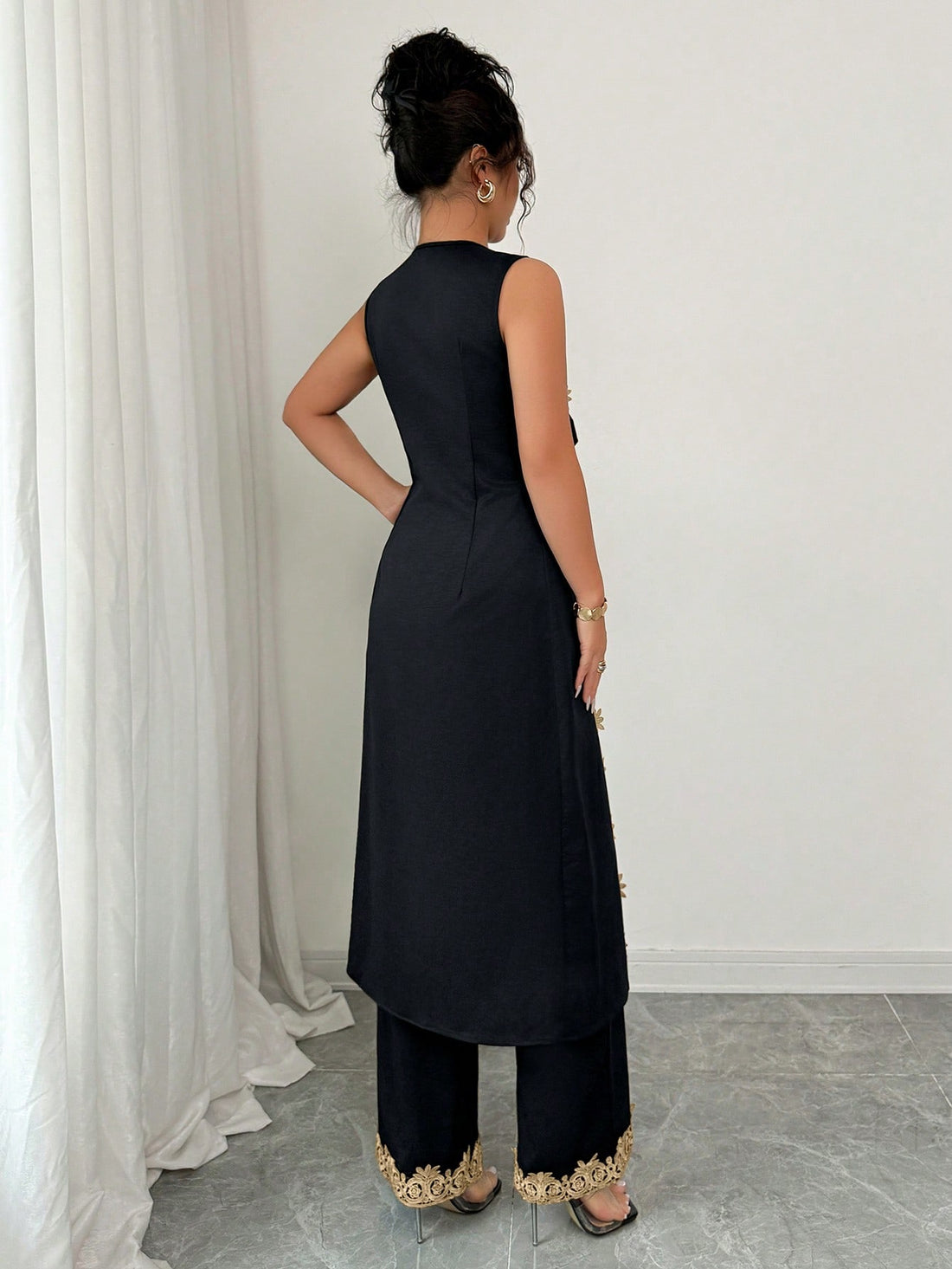 Elevate your warm-weather wardrobe with this effortlessly chic two-piece set! The breezy V-neck top features delicate floral lace trim that adds a touch of feminine elegance, while the flowing wide-leg pants provide all-day comfort and a flattering silhouette. Perfect for casual outings, weekend brunches, or relaxed evenings out, this set strikes the ideal balance between style and ease. Mix and match the pieces with your favorite accessories for endless outfit possibilities!