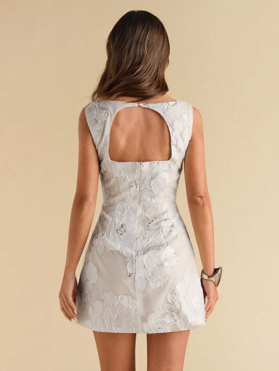 Step into sunshine with this playful powder blue jacquard mini dress. Featuring a flattering square neckline and a daring open back, it’s the perfect pick for spring and summer celebrations. Light, chic, and effortlessly stylish, this dress will have you turning heads wherever you go.