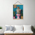 Leopard reading newspaper on pink toilet printed as a hanging scroll canvas above a white sofa
