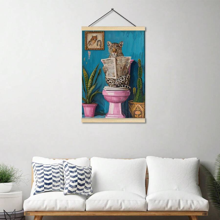 Leopard reading newspaper on pink toilet printed as a hanging scroll canvas above a white sofa