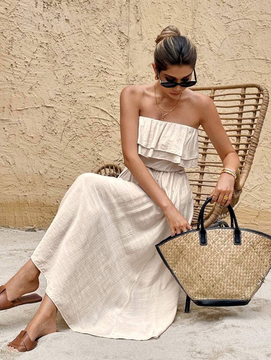 Seated front view of apricot tube dress showing double ruffle bodice and slub woven texture