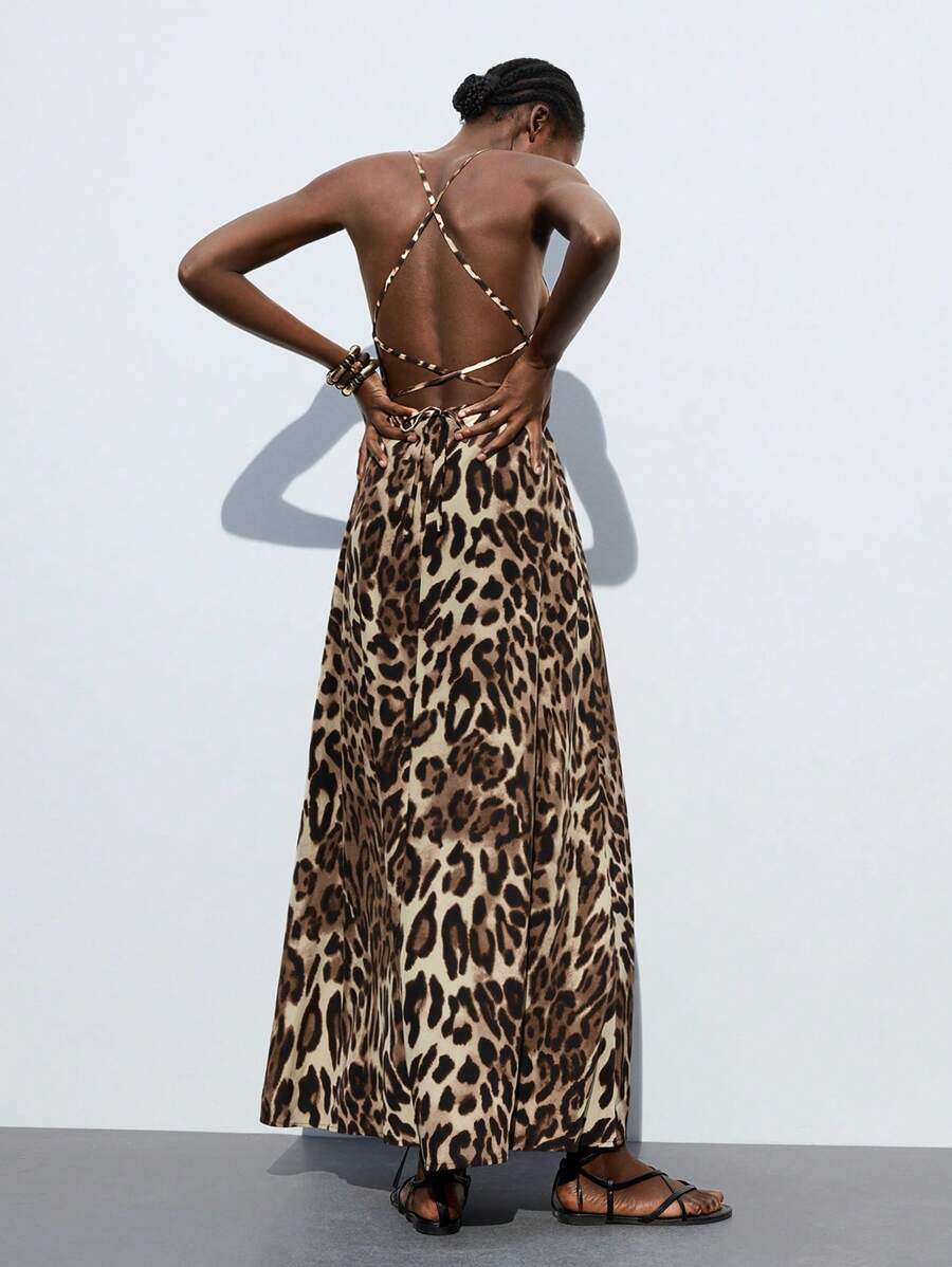 Step out in style with this chic leopard print maxi dress that effortlessly blends office polish with weekend ease. Its flowing silhouette moves gracefully from meetings to brunch, while the bold print adds a playful edge to your wardrobe. Perfect for dressing up with heels or keeping it casual with sneakers, this dress makes every day a fashion adventure.