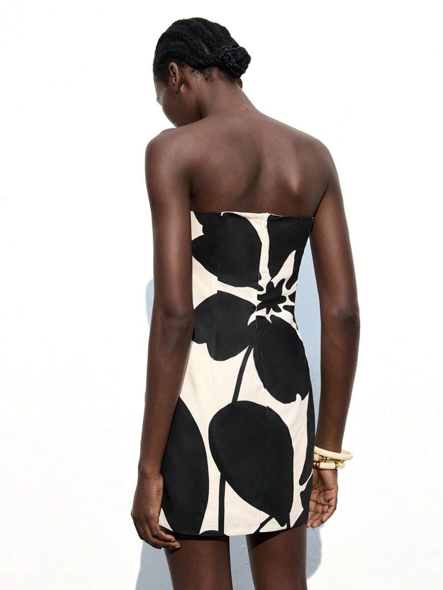 Turn heads wherever you go with this playful khaki floral print tube top mini dress. Light and breezy, it’s your perfect vacation companion or party standout. The flattering tube top style pairs effortlessly with sandals or heels, making every step feel like a dance. Embrace fun and sun in a dress designed to keep your vibe carefree and chic.