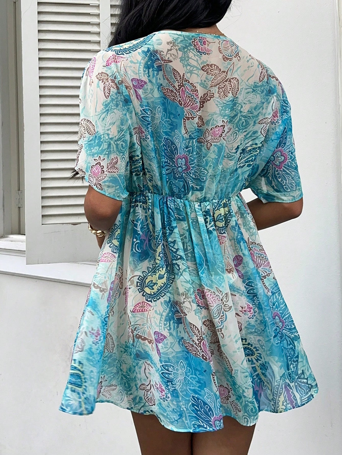 Step into summer fun with this playful paisley print chiffon mini dress. Its lightweight fabric keeps you cool while the breezy silhouette invites effortless movement. Perfect for sunny days or vacation getaways, this dress combines comfort with flirty charm to keep your style fresh and vibrant wherever you go.
