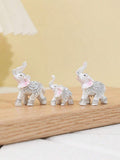 Gift-ready mini elephant figurines for graduation celebrations